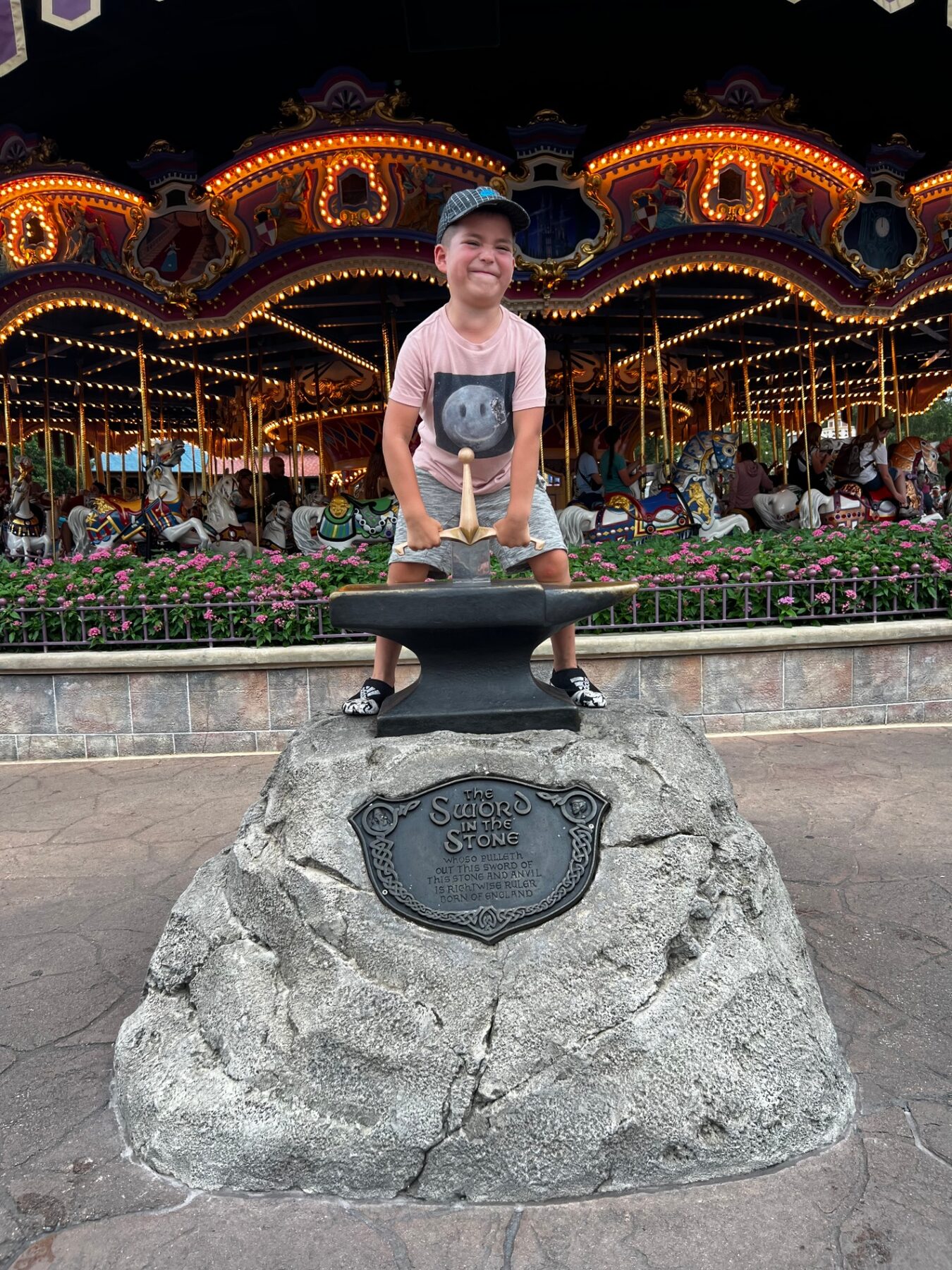 Oliver pretending to pull the sword from the stone.