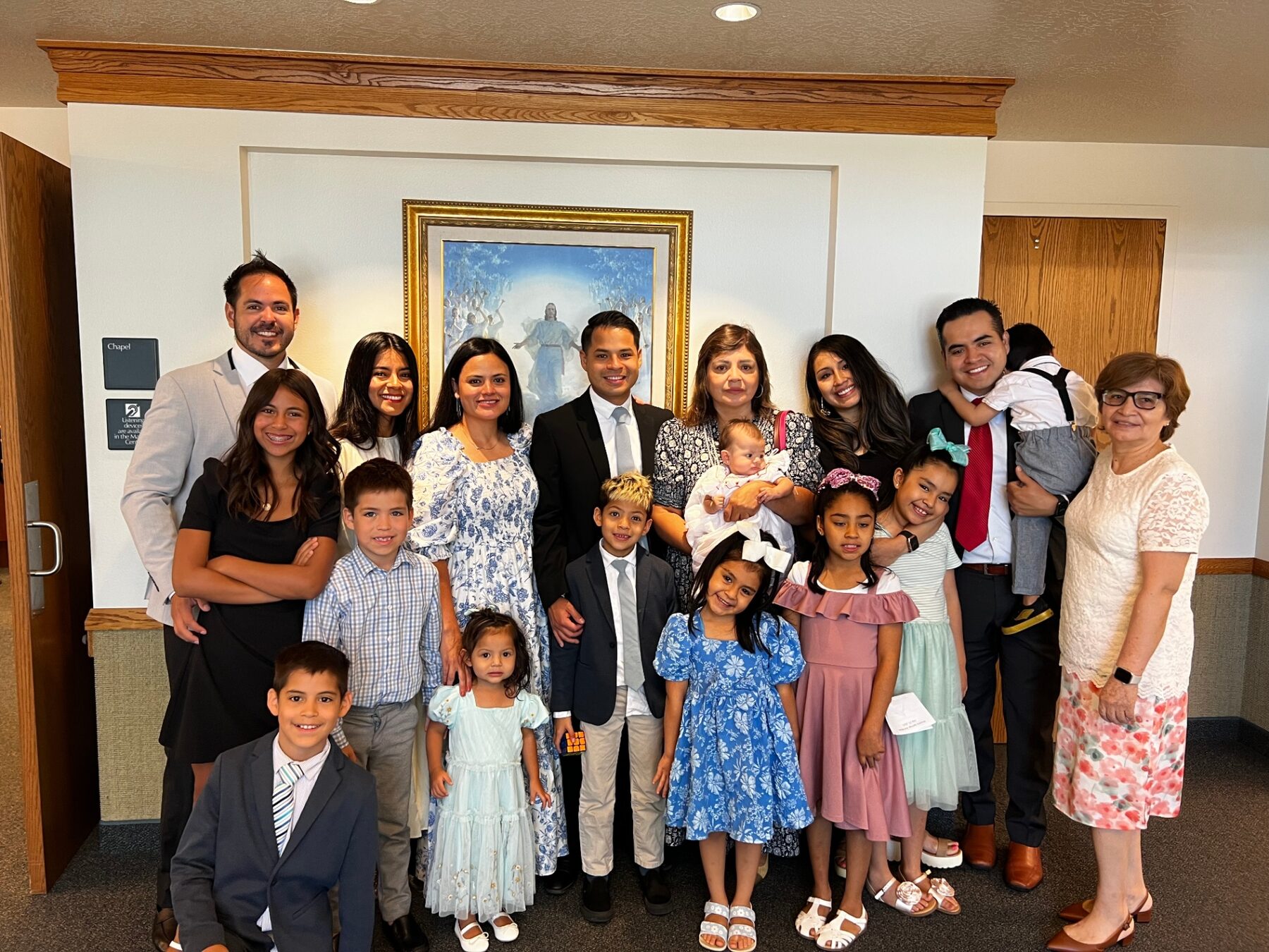 Oliver surrounded by extended family at church.